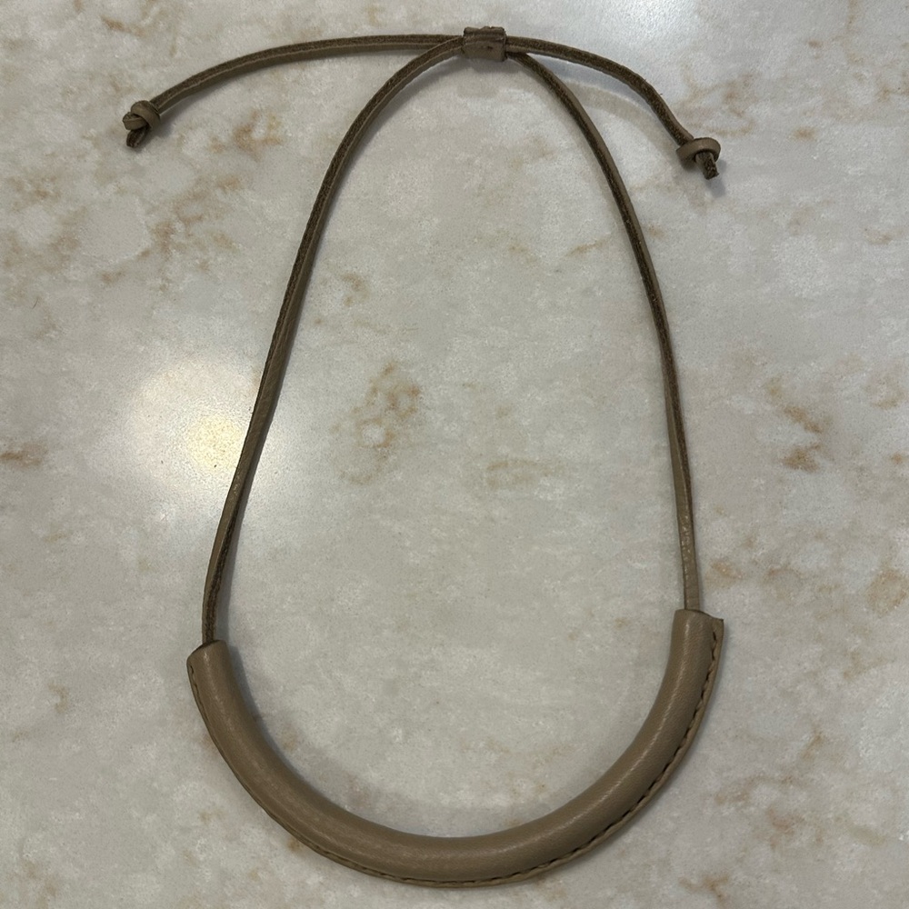 Adjustable Taupe leather necklace.